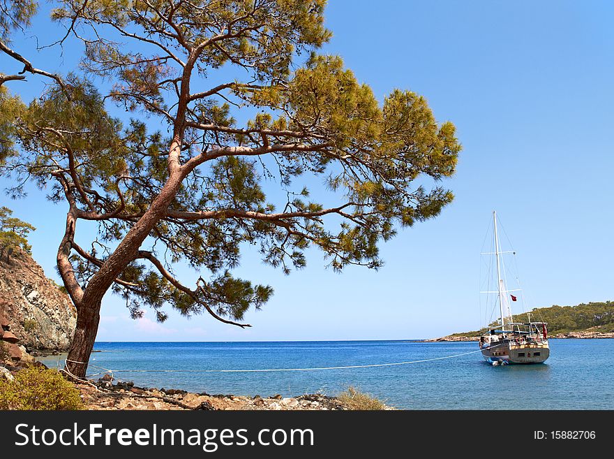 Ship in blue mediterranian bay at a sunny day. Ship in blue mediterranian bay at a sunny day