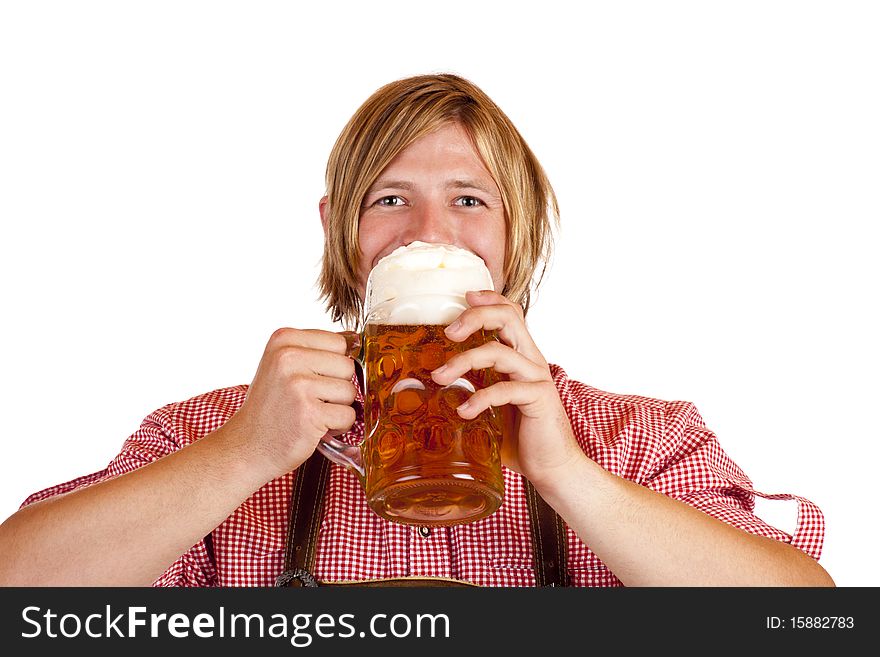 Happy Bavarian man drinks out of oktoberfest beer stein. Isolated on white background.