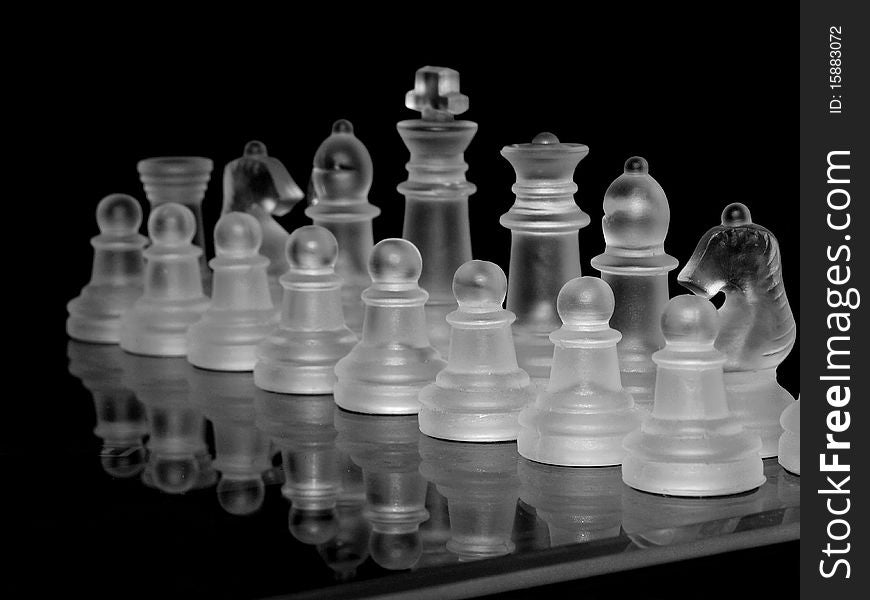 Glass chess on black background