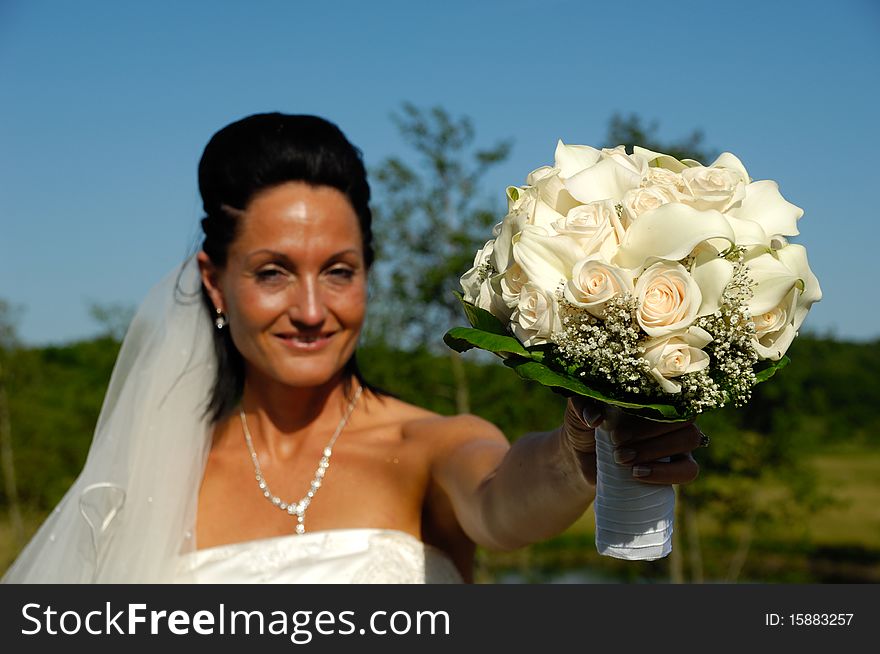 Bride in white dress with flower bouquet. Bride in white dress with flower bouquet