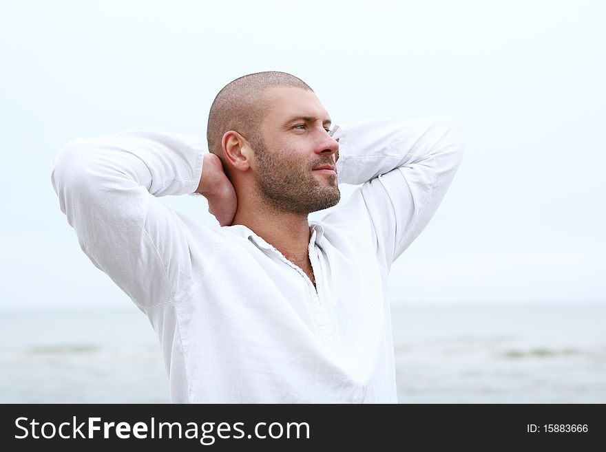 Attractive and happy man on beach