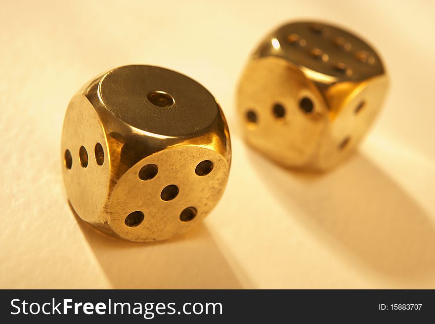 Two brass dice