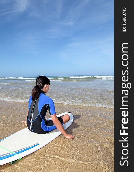 Young girl with surfboard on the beach. Young girl with surfboard on the beach