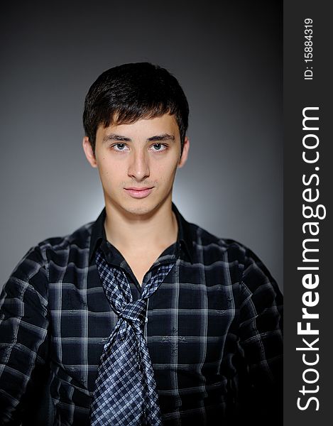 Handsome man in funny shirt and tie smiling