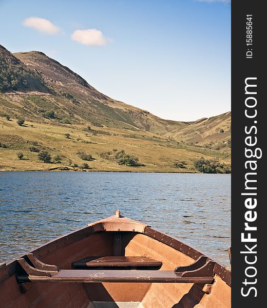 Lake district cumbria mountain view and wooden boat