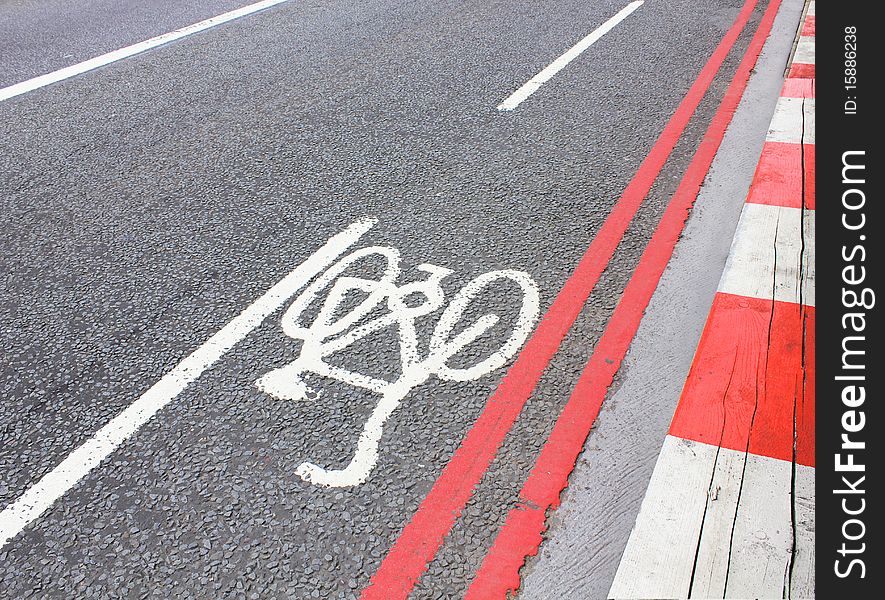 Cycle lane symbol painted on a road