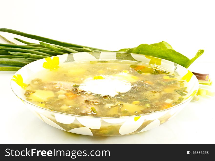 Green soup, sorrel and chives isolated on a white background. Green soup, sorrel and chives isolated on a white background