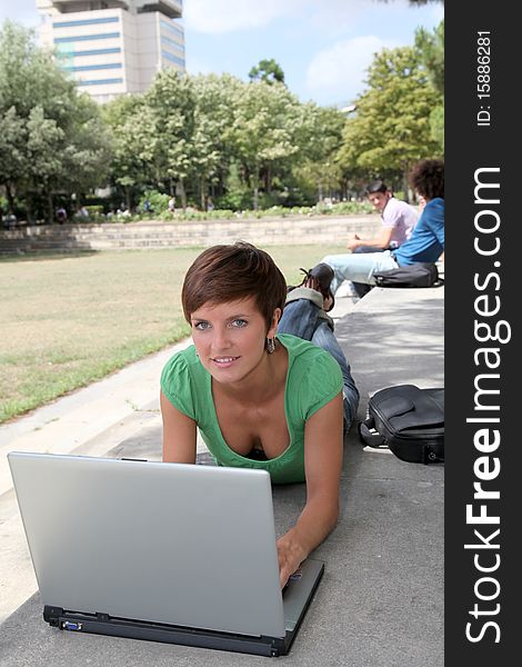 Student with laptop computer in college park. Student with laptop computer in college park