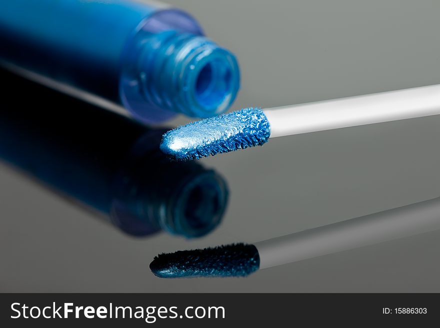 Blue gloss make-up eyeshadows with brush