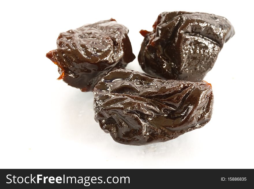 Black plums isolated on a white background. Black plums isolated on a white background