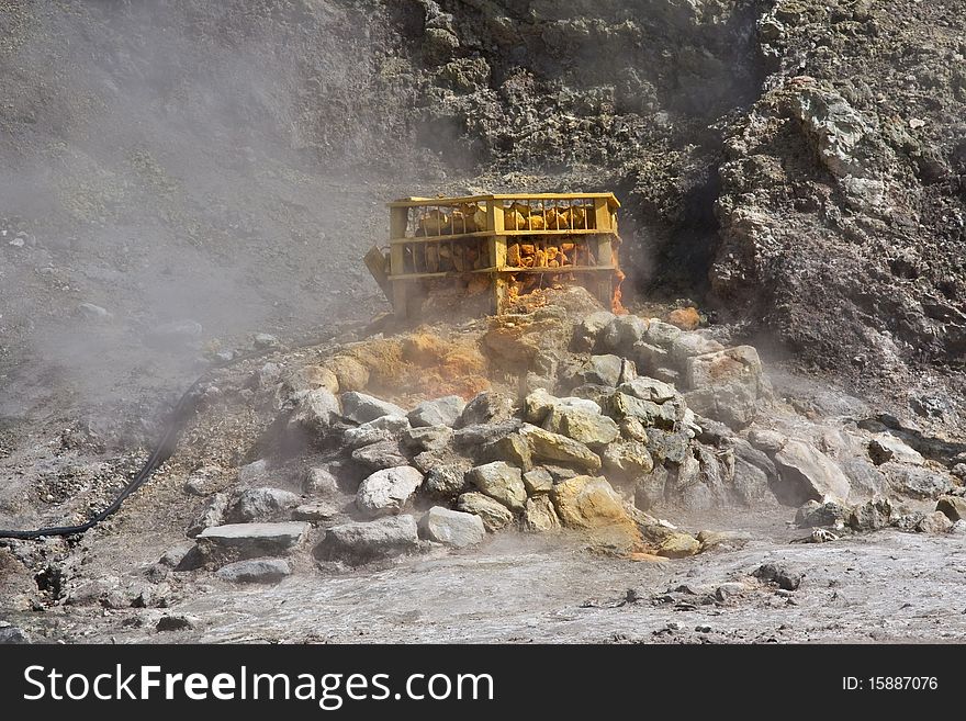 A steaming fumerole & the orange & yellow of sulpher at the Solfatara Crater in Italy