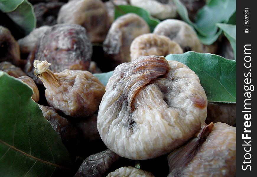 Mediterranean way of draing figs, with laurel leaves, close-up. Mediterranean way of draing figs, with laurel leaves, close-up.