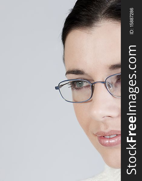 Close-up of a beautiful young woman with glasses