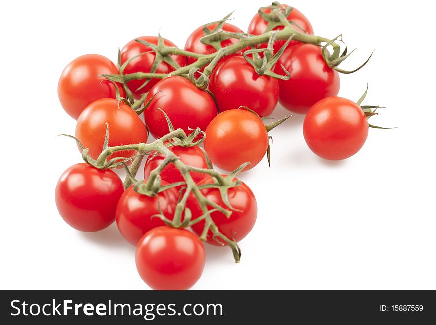 Some fresh tomatoes isolated on white background.