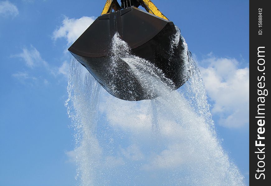 A hoisting crane unloading water