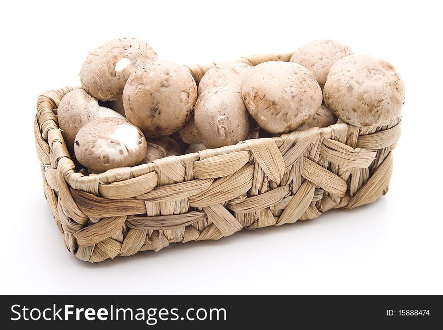 Champignon mushrooms in the basket