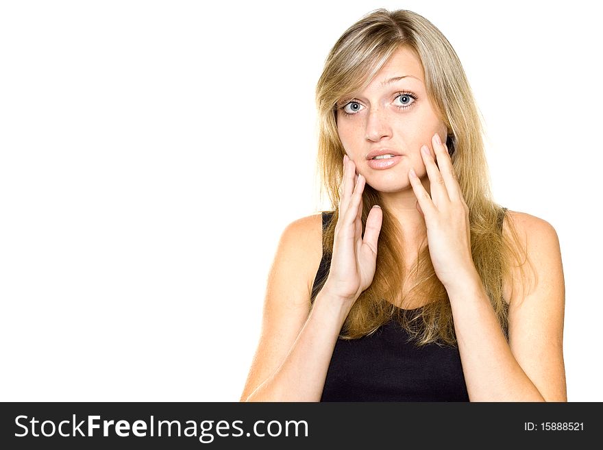 Close-up of a young woman looking surprised on white background