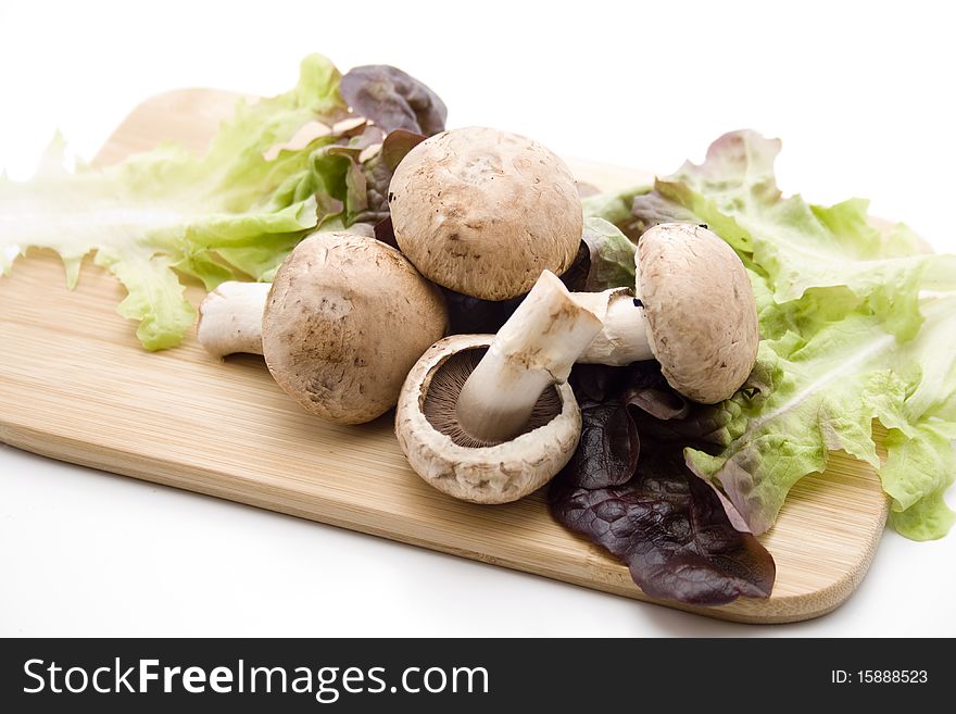 Champignon mushrooms on edge board. Champignon mushrooms on edge board