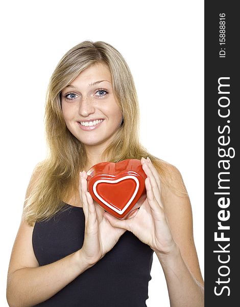 Smiling Young Woman Holding a red Heart. Isolated on white background. Smiling Young Woman Holding a red Heart. Isolated on white background