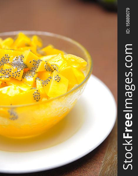 Mango fruit cut into cubes and mixed with blended ice served as dessert. Mango fruit cut into cubes and mixed with blended ice served as dessert
