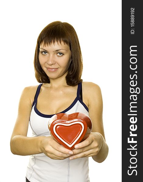 Smiling Young Woman Holding a red Heart. Lots of copyspace and room for text on this isolate. Smiling Young Woman Holding a red Heart. Lots of copyspace and room for text on this isolate