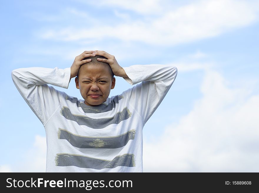 Exasperated bald female holding head wearing striped long sleeve shirt and frustrated expression