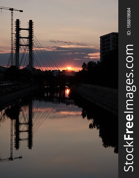 The new bridge yard at sunset with beautiful light and mirrored in the river.