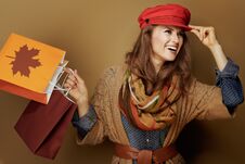 Middle Age Woman With Autumn Shopping Bags Looking Aside Stock Photo