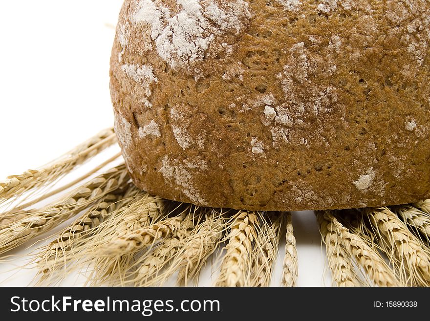 Cut bread and with wheat ears. Cut bread and with wheat ears