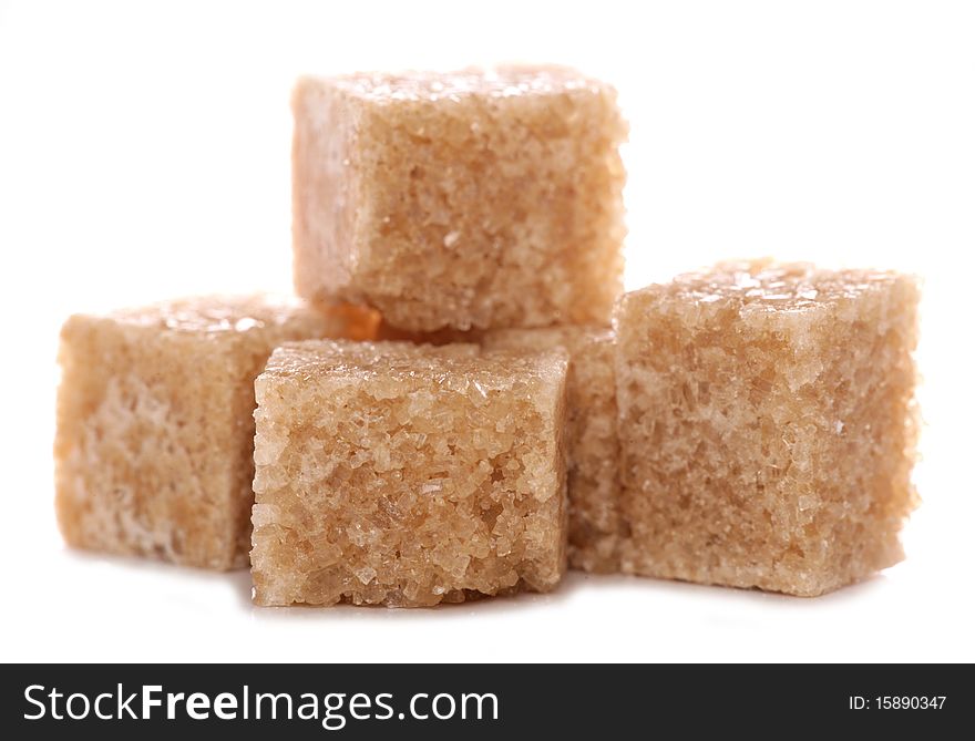 Pile of brown demerara sugar cubes cutout