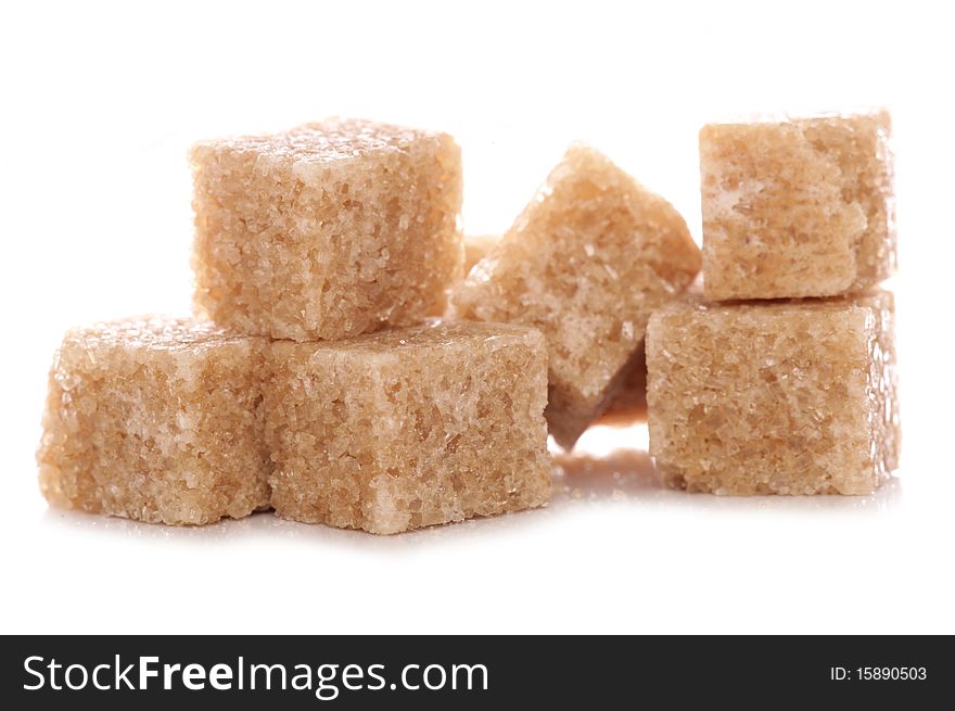 Pile of brown demerara sugar cubes studio cutout