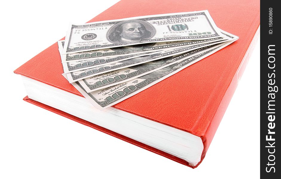 The Book And Dollars On A White Background
