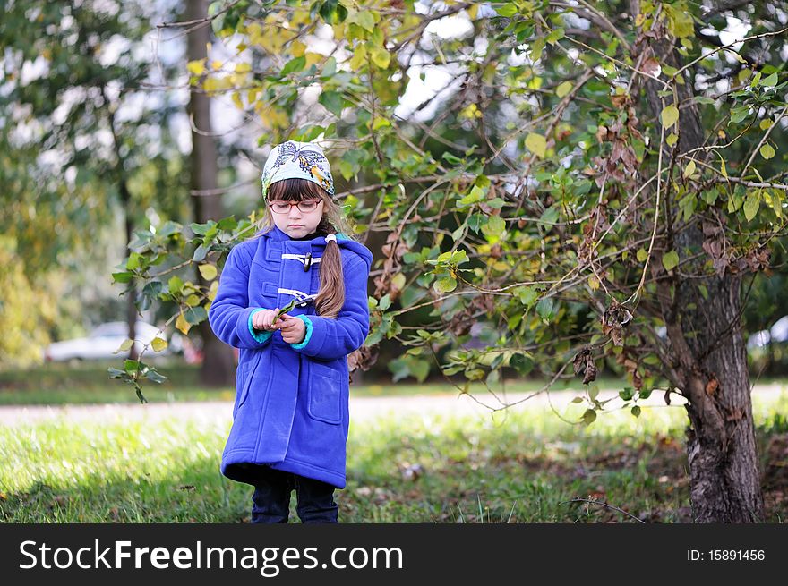 Nice sad little girl in blue coat