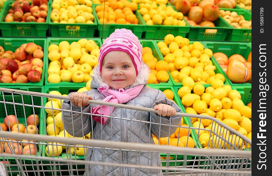 The girl with a basket in shop