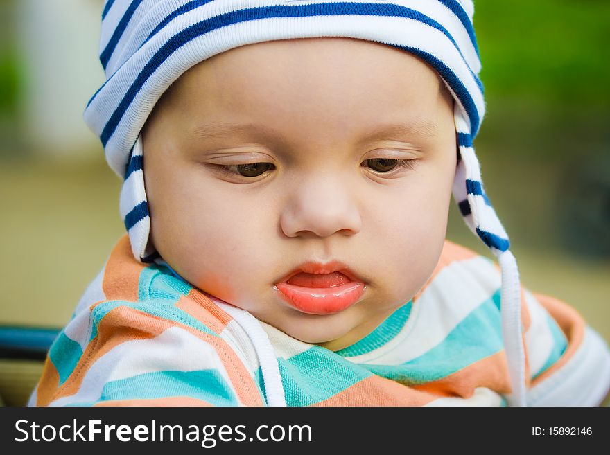 Cute kid in a striped cap