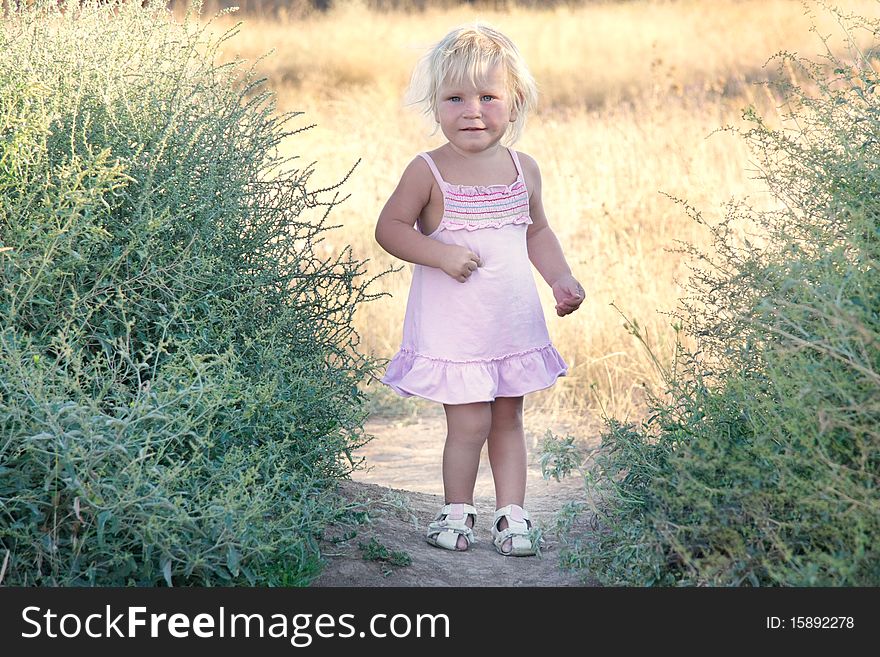 Portrait of cute toddler girl outdoors