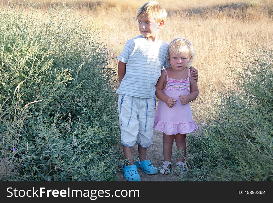 Two kids on rural background