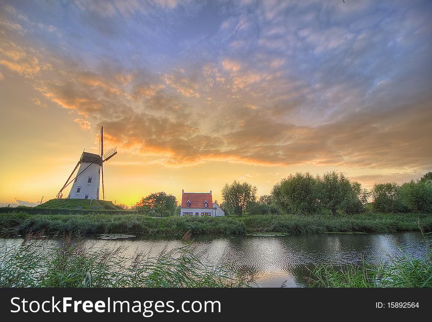 Windmill by sunset in damme brruges,belgium. Windmill by sunset in damme brruges,belgium