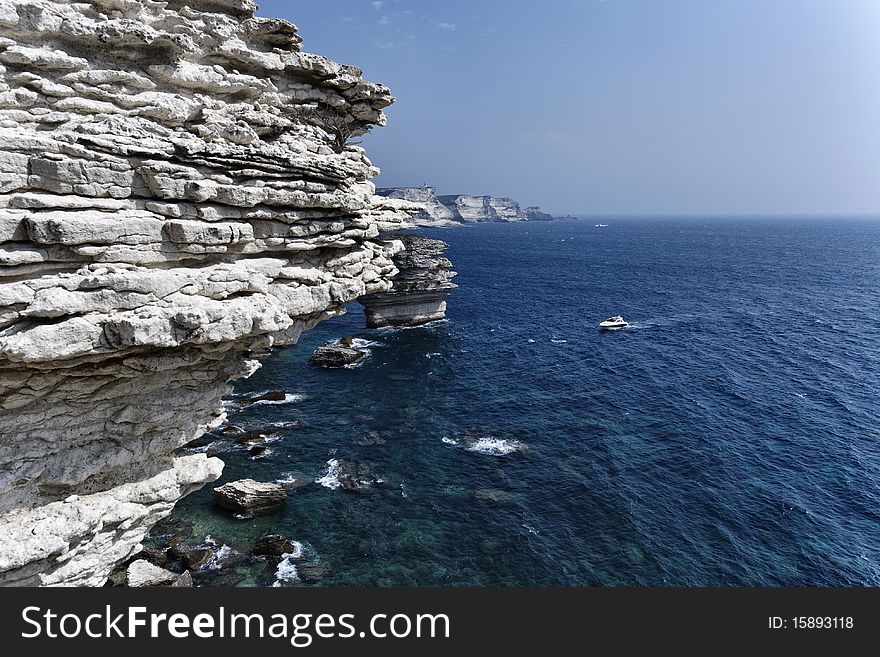 France, Corsica, Bonifacio, view of Bonifacio rocky coast and luxury yacht Azimut 50'