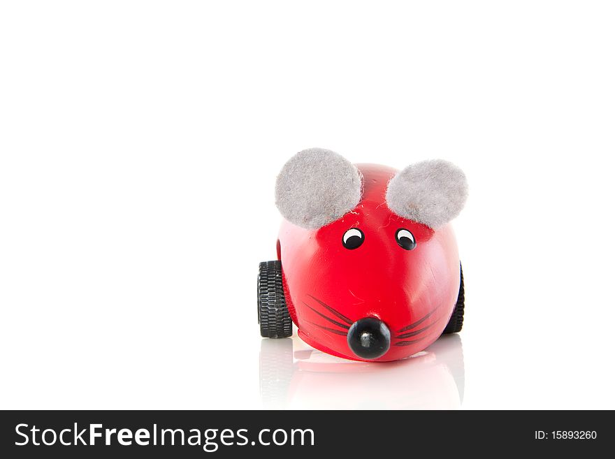 A red wooden toy mouse isolated over white. A red wooden toy mouse isolated over white