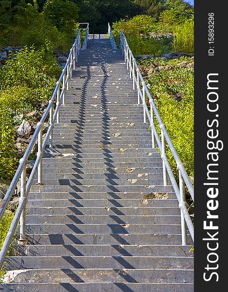Lengthy steps outdoors leading to powerful dam. Lengthy steps outdoors leading to powerful dam