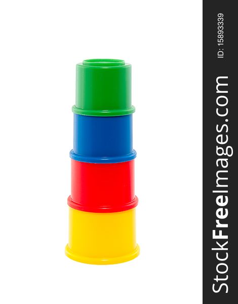 A stack of colorful toy cups isolated over white. A stack of colorful toy cups isolated over white
