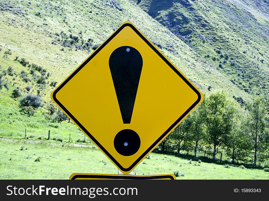 Large exclamation point on a New Zealand road sign creates a humorous and startling statement. Large exclamation point on a New Zealand road sign creates a humorous and startling statement