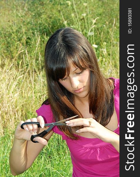 Young woman with scissors