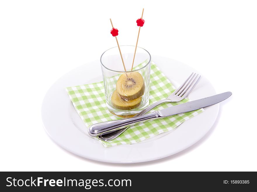 Kiwi fruit in a glass modern decorated and isolated over white