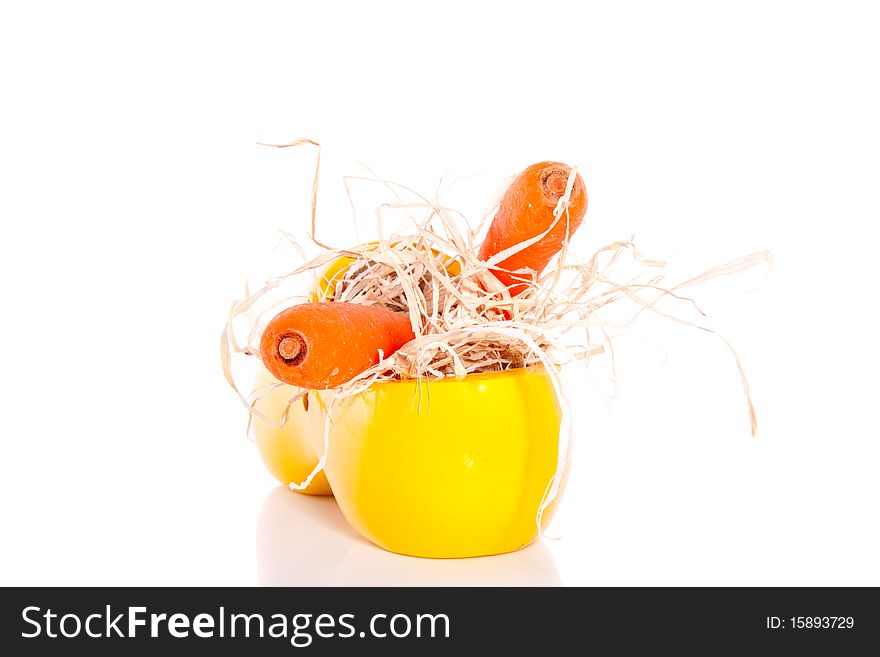 A yellow clog with carrots for the horse of Sinterklaas at five december in Holland isolated over white