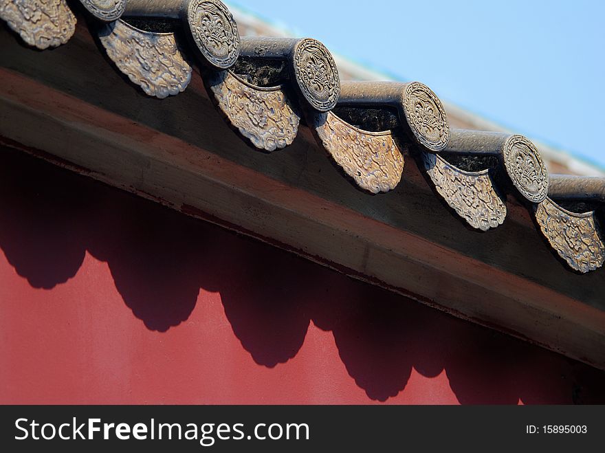 Tile on the red wall in the summer.