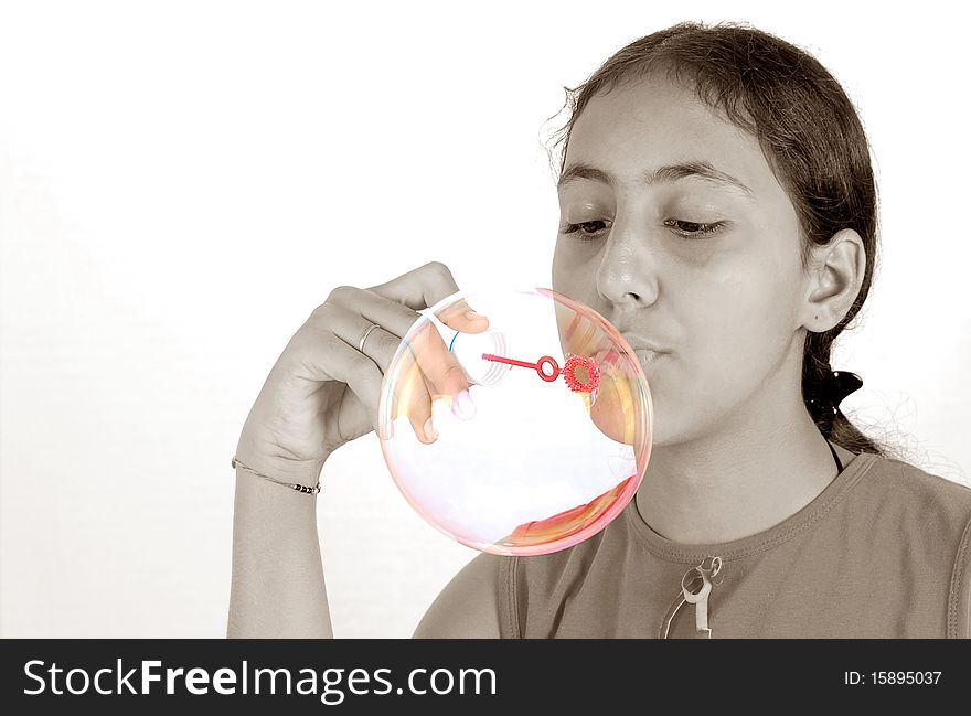 Sepia girl looking at big colorful bubble. Sepia girl looking at big colorful bubble