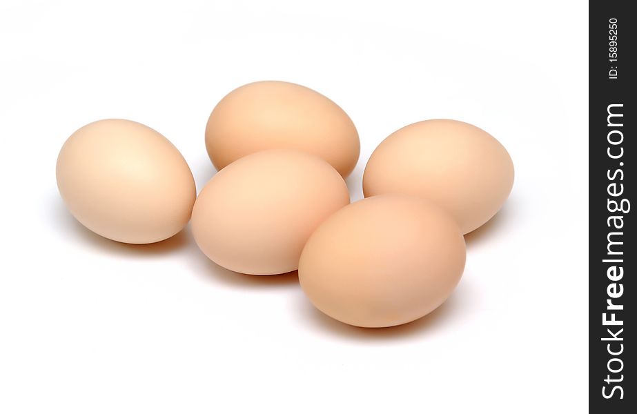 Brown eggs isolated on white