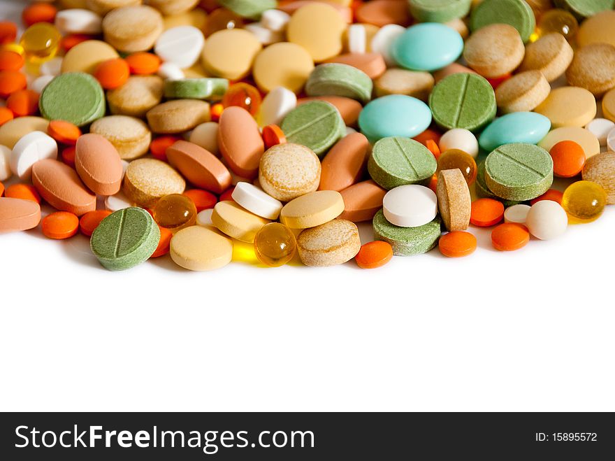 Heap of pills isolated on a white background